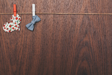 Background, a heart hanging on a rope on a wooden background