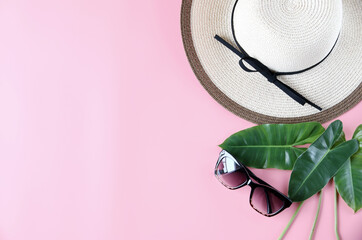 Women's hats,Sunscreen,Green leaf On pink backdrop Concept welcome summer