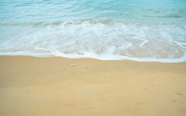Fototapeta na wymiar Sand beach and sea water