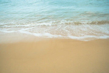 Fototapeta na wymiar Sand beach and sea water