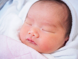 Cute newborn asian baby girl