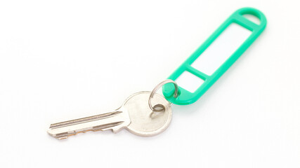 key with green tag