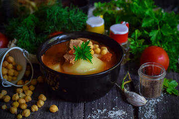 Tomato soup with beef, vegetables and chickpeas