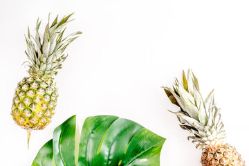 summer mockup with pineapple and leaves white background top view