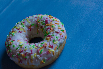 Fototapeta na wymiar Sweet donut with white colors and colors candy