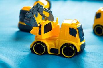 Fototapeta premium Children's toy yellow tractor