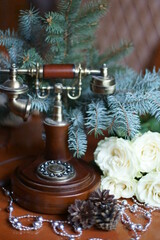 Old phone and white roses. 