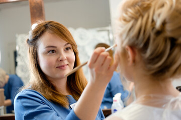 makeup artist making makeup
