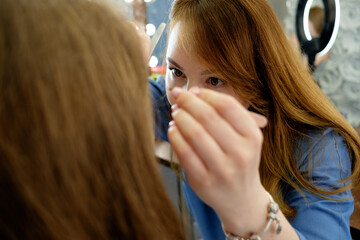 eyebrow maker, make up artist at work