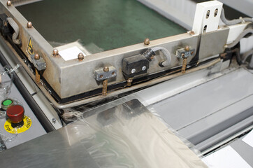 Vintage foil laminator machine detail in offset print plant