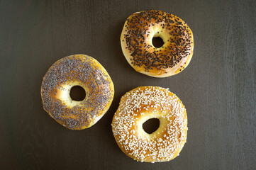 bagels with sesame seeds on a black background