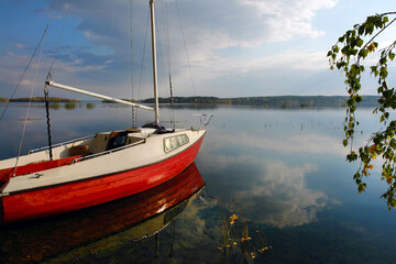 Autumn Sailboat. Reserved places at the Gold Lake South Ural.