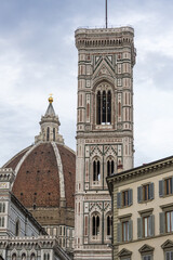 Fototapeta na wymiar Giotto's bell tower and Brunelleschi's dome of Santa Maria del Fiore cathedral, Florence, Tuscany, Italy.