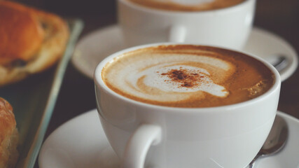 Cappuccino with a French roll for breakfast