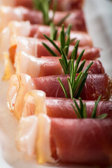 Parma ham slices, cheese and olives