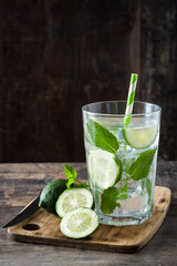 Mojito cocktail in glass on wooden table
