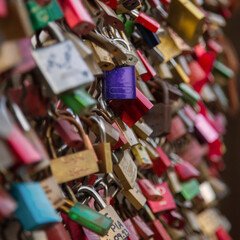 Many padlocks on a bridge