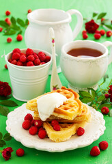 Homemade waffles with wild strawberries. .