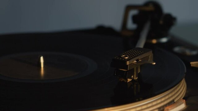 Record player playing an old fashioned vintage vinyl record