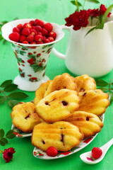 Madeleine cookies with wild strawberries. .