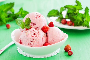 Homemade ice cream with wild strawberry.