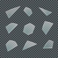 Realistic shards of glass on a transparent dark background. Elements of design. Vector illustration.