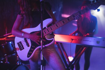 Obraz premium Females performing on illuminated in nightclub