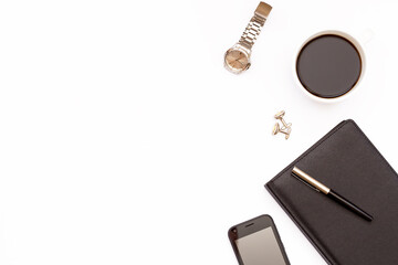 Black diary, pen, phone, watch and a Cup of black coffee on a white background. Minimal business concept for men.