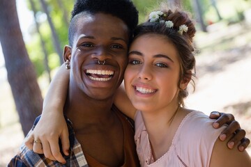 Couple posing together in the park