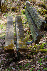 The side view of a moss covered bench