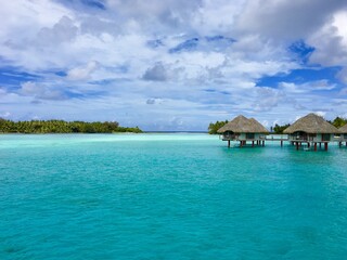 Beautiful turquoise lagoon of Bora Bora and the overwater bungalows of a luxury resort