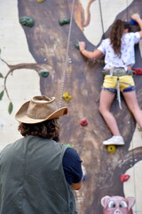 girl climbing wall 