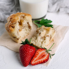 Muffin with milk and strawberries