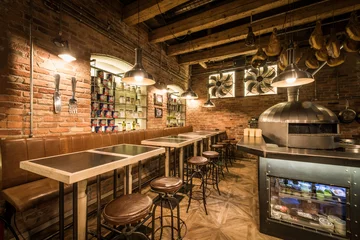 Foto op Plexiglas Interior of pizza restaurant with wood fired oven © poplasen