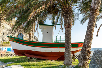 Close-up of a small boat on a beach in Granada