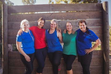 Group of fit women standing together in the boot camp