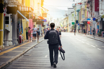 Fototapeta premium Tourist sightseeing old town ,traveling concept.Street photographer wandering on famous walking street in phuket old town.