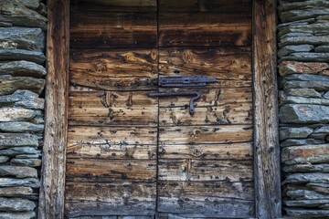 Antique door of a hut in Val Febbraro. Val Febbraro, Vallespluga, Valchiavenna,Valtellina Lombardy Italy Europe