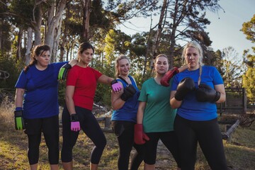 Group of fit women relaxing together in the boot camp