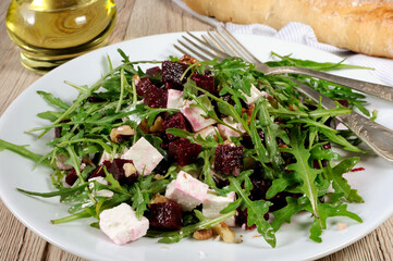 Roasted beets, arugula, cheese feta, and walnuts