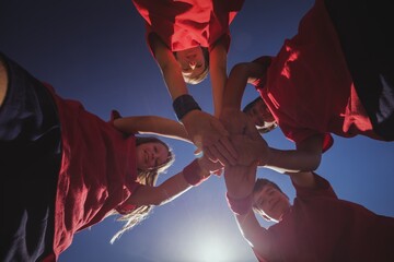 Kids forming hand stack in the boot camp