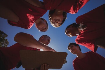 Trainer instructing kids in the boot camp