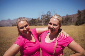 Two women standing together in the boot camp
