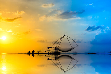 Silhouettes of Minimal fisherman at the lake, Thailand.