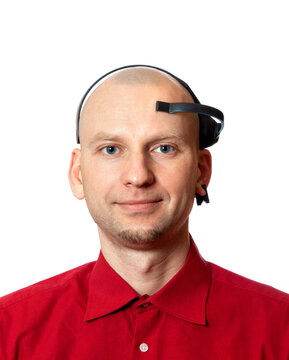 Portrait Of Young Man With Electroencephalography (EEG) Headset On Head