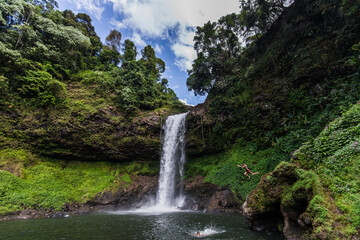 waterfalls inside the pakse forest in Laos during a sunny day.