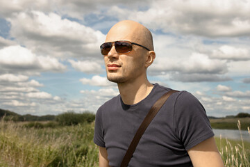 Portrait of a handsome young man with sunglasses