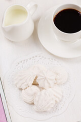 Homemade zephyr and coffee on wooden tray
