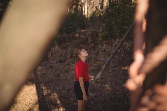 Determined girl looking at outdoor equipment