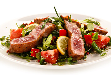 Beef with vegetables on white background